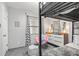 Bedroom with a bunk bed, dresser, and a pink accent chair at 2700 Ocean Shore Blvd # 508, Ormond Beach, FL 32176