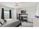 Bedroom with a desk setup, window with curtains, and a comfortable bed at 2700 Ocean Shore Blvd # 508, Ormond Beach, FL 32176