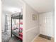 Bunk bed in a bedroom with gray carpeting and a view of a hallway at 2700 Ocean Shore Blvd # 508, Ormond Beach, FL 32176