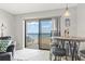 Ocean view dining area with sliding glass doors leading to a balcony at 2700 Ocean Shore Blvd # 508, Ormond Beach, FL 32176