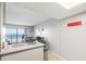 Kitchen with ocean view, gray cabinets, and quartz countertops at 2700 Ocean Shore Blvd # 508, Ormond Beach, FL 32176