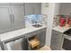 Kitchen features gray cabinets and a stylish quartz countertop at 2700 Ocean Shore Blvd # 508, Ormond Beach, FL 32176