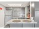 Modern kitchen with gray cabinets, stainless steel appliances, and a spacious island at 2700 Ocean Shore Blvd # 508, Ormond Beach, FL 32176