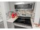 Stainless steel stove and microwave in updated kitchen at 2700 Ocean Shore Blvd # 508, Ormond Beach, FL 32176