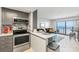 Open concept kitchen with ocean view and gray cabinets at 2700 Ocean Shore Blvd # 508, Ormond Beach, FL 32176