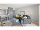 Living area with gray couch and teal ottoman at 2700 Ocean Shore Blvd # 508, Ormond Beach, FL 32176