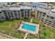 Inviting community pool with surrounding lounge chairs at 2700 Ocean Shore Blvd # 508, Ormond Beach, FL 32176