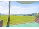 Lush green backyard leading to a tranquil waterfront view at 53 Ocean Palm Villa S # 53, Flagler Beach, FL 32136