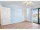 Bright bedroom with sliding glass doors and closet at 53 Ocean Palm Villa S # 53, Flagler Beach, FL 32136