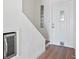 Entryway with white door, glass block window, and staircase at 53 Ocean Palm Villa S # 53, Flagler Beach, FL 32136