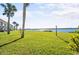 Exterior view of the property with palm trees and a waterfront view at 53 Ocean Palm Villa S # 53, Flagler Beach, FL 32136
