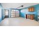 Garage interior with storage cabinets and garage door opener at 53 Ocean Palm Villa S # 53, Flagler Beach, FL 32136