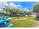 Community kayak launch with storage racks, picnic table, and tropical landscaping at 53 Ocean Palm Villa S # 53, Flagler Beach, FL 32136