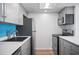 Kitchen with stainless steel appliances, gray cabinets, and white countertops at 53 Ocean Palm Villa S # 53, Flagler Beach, FL 32136