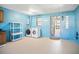 Laundry room with washer, dryer, and storage shelves at 53 Ocean Palm Villa S # 53, Flagler Beach, FL 32136