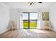 Bright living room with sliding glass doors offering scenic waterfront views at 53 Ocean Palm Villa S # 53, Flagler Beach, FL 32136