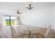 Living room with a dining table, wicker chairs, and a view of the waterfront at 53 Ocean Palm Villa S # 53, Flagler Beach, FL 32136