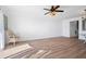 Living room with wood-look flooring, ceiling fan, and natural light at 53 Ocean Palm Villa S # 53, Flagler Beach, FL 32136