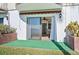 Private patio with sliding glass door access to the living room and waterfront views at 53 Ocean Palm Villa S # 53, Flagler Beach, FL 32136