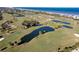 Aerial view of golf course with oceanfront location at 89 S Atlantic Ave # 1401, Ormond Beach, FL 32176