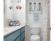 Bathroom with teal vanity, shower, and beach decor at 89 S Atlantic Ave # 1401, Ormond Beach, FL 32176