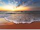Ocean waves rolling onto sandy beach at sunrise at 89 S Atlantic Ave # 1401, Ormond Beach, FL 32176