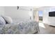 Bedroom with a queen bed, balcony access, and ocean view at 89 S Atlantic Ave # 1401, Ormond Beach, FL 32176