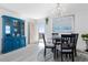 Dining room with blue hutch and chandelier, ocean view at 89 S Atlantic Ave # 1401, Ormond Beach, FL 32176