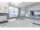 Bright kitchen boasts white cabinets and ocean views at 89 S Atlantic Ave # 1401, Ormond Beach, FL 32176