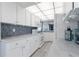White kitchen with blue tile backsplash, ocean view at 89 S Atlantic Ave # 1401, Ormond Beach, FL 32176