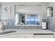 Kitchen features a pass-through window with an ocean view at 89 S Atlantic Ave # 1401, Ormond Beach, FL 32176