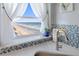Kitchen sink with ocean view from window at 89 S Atlantic Ave # 1401, Ormond Beach, FL 32176