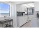 Ocean view kitchen, white cabinets, granite counters at 89 S Atlantic Ave # 1401, Ormond Beach, FL 32176
