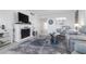 Living room featuring fireplace and comfortable seating at 89 S Atlantic Ave # 1401, Ormond Beach, FL 32176
