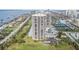 Aerial view of a luxurious condo building with ocean and city views at 1 Oceans West Blvd # 5B3, Daytona Beach, FL 32118