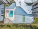 Aerial view of condo complex with pool, shuffleboard, and parking at 1 Oceans West Blvd # 5B3, Daytona Beach, FL 32118