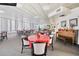 Spacious community room with tables, chairs, and a piano at 1 Oceans West Blvd # 5B3, Daytona Beach, FL 32118