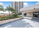 Landscaped condo entrance with covered area at 1 Oceans West Blvd # 5B3, Daytona Beach, FL 32118