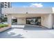 Condo building entrance with covered parking at 1 Oceans West Blvd # 5B3, Daytona Beach, FL 32118