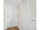 Bright condo entryway with white door and built-in storage at 1 Oceans West Blvd # 5B3, Daytona Beach, FL 32118