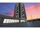 Luxury high rise building exterior at sunset at 1 Oceans West Blvd # 5B3, Daytona Beach, FL 32118