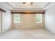 Main bedroom with neutral wall decor and carpeted floor at 63 Village Dr, Ormond Beach, FL 32174