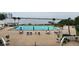 Community pool with patio furniture and waterfront view at 935 N Halifax Ave # 602, Daytona Beach, FL 32118