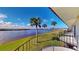 Private balcony overlooking the water and lush landscape at 11 Ocean Palm Villa S # 11, Flagler Beach, FL 32136