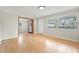 Bright living room with hardwood floors and French doors at 656 Winchester St, Daytona Beach, FL 32114