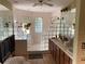 Bathroom with double vanity and glass block shower at 2436 Cr 416N, Lake Panasoffkee, FL 33538