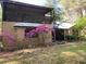 Home with blooming azaleas, screened porch, and metal roof at 2436 Cr 416N, Lake Panasoffkee, FL 33538