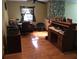 Home office with wood floors and built-in desk at 2436 Cr 416N, Lake Panasoffkee, FL 33538