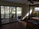 Bedroom with sliding doors to patio at 2436 Cr 416N, Lake Panasoffkee, FL 33538