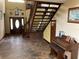 Grand entry with stone flooring, staircase, and wood accents at 2436 Cr 416N, Lake Panasoffkee, FL 33538